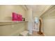 Walk-in closet with shelving and hanging space offers ample storage and organization options at 777 Beach Rd # 1B, Sarasota, FL 34242