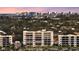 Apartment building exterior showcasing multiple windows and a city skyline in the background at 777 Beach Rd # 1B, Sarasota, FL 34242