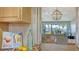 A pass-through from the kitchen looking to the dining and living spaces with views to the outside at 777 Beach Rd # 1B, Sarasota, FL 34242