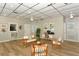 Relax in the spacious lobby with wood floors, comfortable seating, a work area, and local artwork at 777 Beach Rd # 1B, Sarasota, FL 34242
