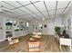 Bright lobby featuring wood floors, comfortable seating areas, a reception window, and local Sarasota artwork at 777 Beach Rd # 1B, Sarasota, FL 34242