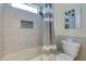 Nicely designed bathroom featuring a shower/tub, toilet and designer tile work at 803 Gladiolus St, Anna Maria, FL 34216