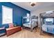bedroom with hardwood floors, ceiling fan, large window, and bunkbeds at 803 Gladiolus St, Anna Maria, FL 34216