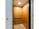 Interior view of the home's wood paneled elevator at 803 Gladiolus St, Anna Maria, FL 34216