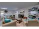Bright game room with ping pong, seating area, a tv, and storage at 803 Gladiolus St, Anna Maria, FL 34216