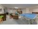 Spacious game room featuring a ping pong table and lounging area at 803 Gladiolus St, Anna Maria, FL 34216