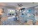Comfortable living room with a comfy sectional sofa, access to the balcony, and an open layout at 803 Gladiolus St, Anna Maria, FL 34216