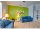 Cozy living room with coastal-themed decor, comfortable seating, and an abundance of natural light at 803 Gladiolus St, Anna Maria, FL 34216