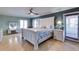 Serene main bedroom with a coastal vibe, featuring ample natural light and comfortable furnishings at 803 Gladiolus St, Anna Maria, FL 34216
