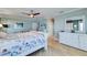 Comfortable main bedroom with nautical décor, featuring a ceiling fan and hardwood flooring at 803 Gladiolus St, Anna Maria, FL 34216