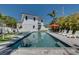 Beautiful pool, hot tub, and backyard with landscaping, patio and exterior of home at 803 Gladiolus St, Anna Maria, FL 34216