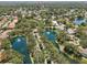 Aerial view of community homes surrounded by lush landscapes and sparkling waterways at 8146 Shadow Pine Way, Sarasota, FL 34238