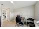 Well-lit bedroom with desk, ceiling fan, and ample space for work or relaxation at 8146 Shadow Pine Way, Sarasota, FL 34238