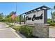 Deer Creek on Palmer Ranch community sign with an American flag and attractive landscaping at 8146 Shadow Pine Way, Sarasota, FL 34238