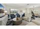 Bright and open living space with tile floors, comfortable seating, and a view to the outside at 8146 Shadow Pine Way, Sarasota, FL 34238