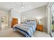 Tranquil main bedroom with a ceiling fan, dresser, and ensuite bathroom at 8146 Shadow Pine Way, Sarasota, FL 34238