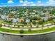 Expansive aerial view showcasing a community of beautiful homes along the waterfront with lush greenery at 829 Bayshore Blvd, Tampa, FL 33606