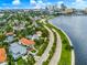 Scenic aerial view of homes along the water showcasing Tampa skyline and lush greenery at 829 Bayshore Blvd, Tampa, FL 33606