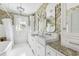 Elegant bathroom featuring double sinks, granite countertops, and beautiful floral wallpaper at 829 Bayshore Blvd, Tampa, FL 33606
