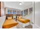 Bright bedroom features twin beds with woven headboards and large windows with scenic views at 829 Bayshore Blvd, Tampa, FL 33606