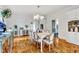 Formal dining room with hardwood floors and bright chandelier at 829 Bayshore Blvd, Tampa, FL 33606