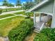 Charming front porch with classic details, offering a relaxing outdoor space with a view of the lush front yard at 829 Bayshore Blvd, Tampa, FL 33606