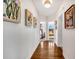 Hallway featuring wood floors and art pieces leading to two bedrooms at 829 Bayshore Blvd, Tampa, FL 33606
