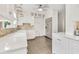 This bright kitchen offers modern, stainless steel appliances, white cabinets, and tile floors at 829 Bayshore Blvd, Tampa, FL 33606