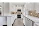 Spacious kitchen featuring stainless steel appliances, custom cabinetry and tiled backsplash at 829 Bayshore Blvd, Tampa, FL 33606