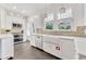 Gleaming kitchen featuring a farmhouse sink, stainless steel appliances and large windows at 829 Bayshore Blvd, Tampa, FL 33606