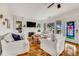 Inviting living room with cozy seating, fireplace, hardwood floors and decorative stained glass door at 829 Bayshore Blvd, Tampa, FL 33606