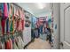 Spacious walk-in closet with built-in shelving and ample storage space for clothes and accessories at 8643 46Th Avenue W Cir, Bradenton, FL 34210