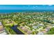 Beautiful aerial view showing waterfront home with a private pool and serene surrounding community at 9226 13Th Avenue Nw Cir, Bradenton, FL 34209