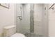 Modern bathroom features a glass shower with pebble accents and sleek fixtures at 9226 13Th Avenue Nw Cir, Bradenton, FL 34209