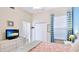 Bright bedroom featuring a queen-sized bed, double closet, and adjacent bathroom at 9226 13Th Avenue Nw Cir, Bradenton, FL 34209