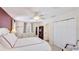 Bedroom with a large white bed, bright natural light, and a double door closet at 9226 13Th Avenue Nw Cir, Bradenton, FL 34209