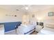 Nautical themed bedroom with two twin beds, navy wainscoting, and a white dresser at 9226 13Th Avenue Nw Cir, Bradenton, FL 34209