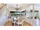 The light-filled breakfast nook features a built-in bench and a view of the outdoor patio at 9226 13Th Avenue Nw Cir, Bradenton, FL 34209