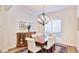 This formal dining room has a chandelier, a wooden table with chairs and a display cabinet at 9226 13Th Avenue Nw Cir, Bradenton, FL 34209