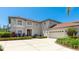 Elegant two-story home with a well-manicured lawn, beautiful landscaping, and a spacious three-car garage at 9226 13Th Avenue Nw Cir, Bradenton, FL 34209