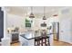 This spacious kitchen has an island, stainless appliances, light countertops and floors at 9226 13Th Avenue Nw Cir, Bradenton, FL 34209