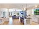 This great room features an open floor plan with kitchen, dining area, and a living room with fireplace at 9226 13Th Avenue Nw Cir, Bradenton, FL 34209