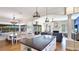 This great room features an open floor plan with kitchen, dining area, and a living room with fireplace at 9226 13Th Avenue Nw Cir, Bradenton, FL 34209