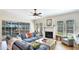 A cozy living room with fireplace, stylish furnishings, and view of the patio at 9226 13Th Avenue Nw Cir, Bradenton, FL 34209