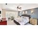 Inviting main bedroom with a ceiling fan, and a bay window with custom shutters at 9226 13Th Avenue Nw Cir, Bradenton, FL 34209