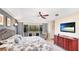 Comfortable main bedroom with a ceiling fan, and balcony access with outdoor seating at 9226 13Th Avenue Nw Cir, Bradenton, FL 34209