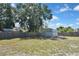 Fenced backyard with sheds offers privacy and storage at 1011 Bacon Ave, Sarasota, FL 34232