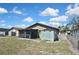View of backyard, shed, and screened in porch at 1011 Bacon Ave, Sarasota, FL 34232