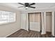 Bright bedroom with stylish ceiling fan, ample closet space, and wood-look floors at 1011 Bacon Ave, Sarasota, FL 34232