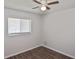Cozy bedroom with new floors, neutral paint, ceiling fan, and ample natural light at 1011 Bacon Ave, Sarasota, FL 34232